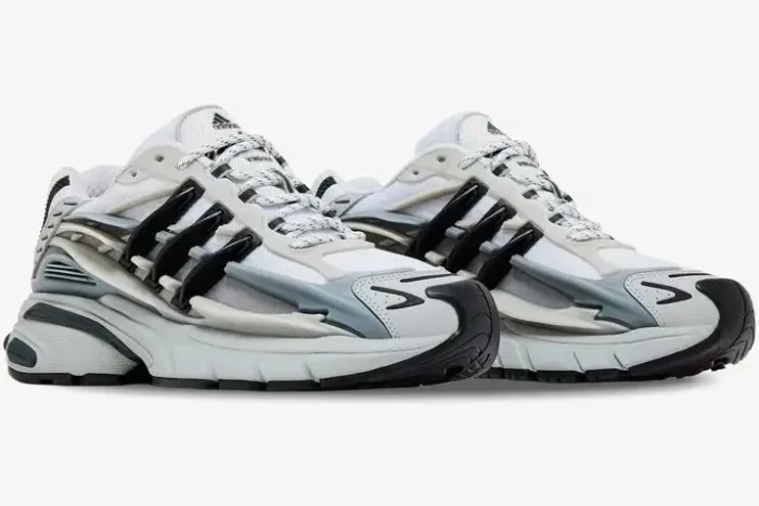 Pharrell x adidas Adistar Jellyfish in solid grey and black, three-quarter side view of both sneakers. - SKU JP9265