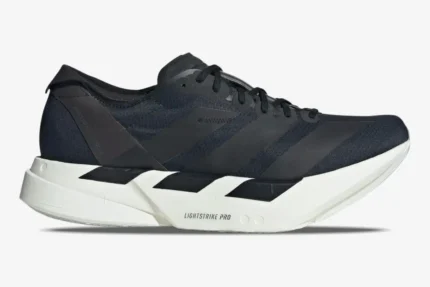 Side profile of Adidas Adizero Adios Pro 4 running shoe in black and white. - SKU JR6369