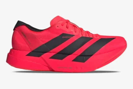 Side view of the red and black Adidas Adizero Adios Pro 4 marathon running shoe. - SKU JR6368