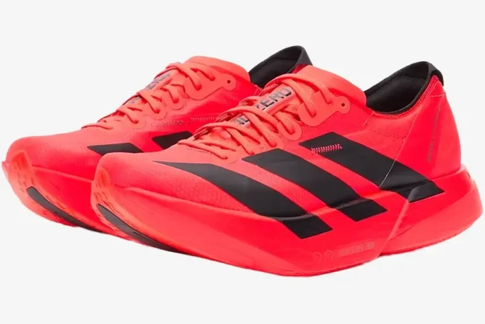 Adidas Adizero Adios Pro 4 running shoes in bright red and black, three-quarter side view perspective. - SKU JR6368