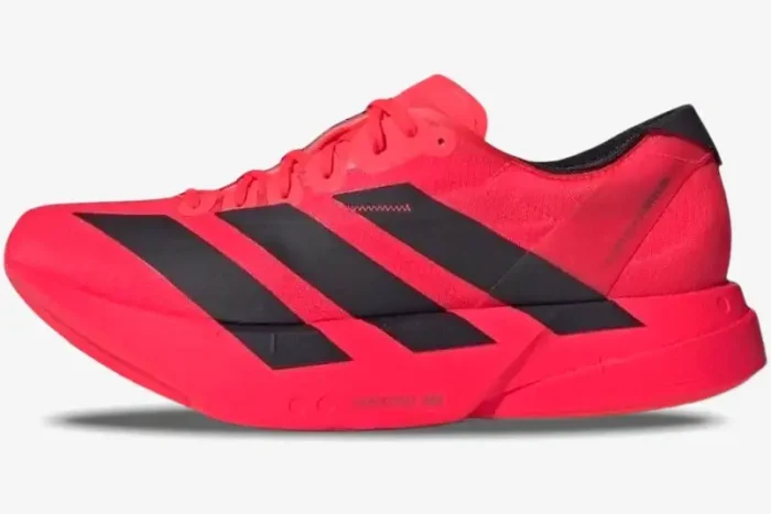 Side profile of a bright red Adidas Adizero Adios Pro 4 running shoe with bold black stripes. - SKU JR6368