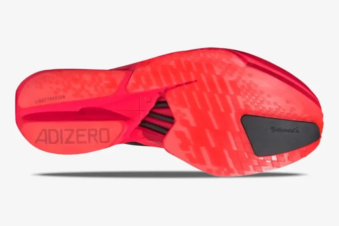 Bottom view of the red Adidas Adizero Adios Pro 4 running shoe outsole with Continental rubber. - SKU JR6368