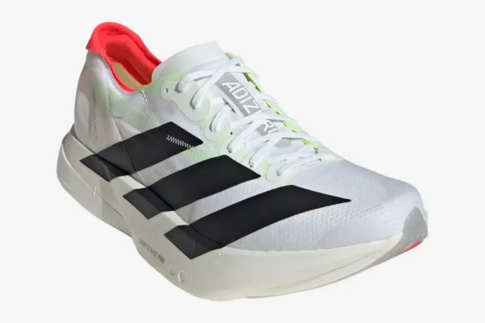 White Adidas Adizero Adios Pro 4 running shoe with black stripes and red heel, front angle view. - SKU JR1094