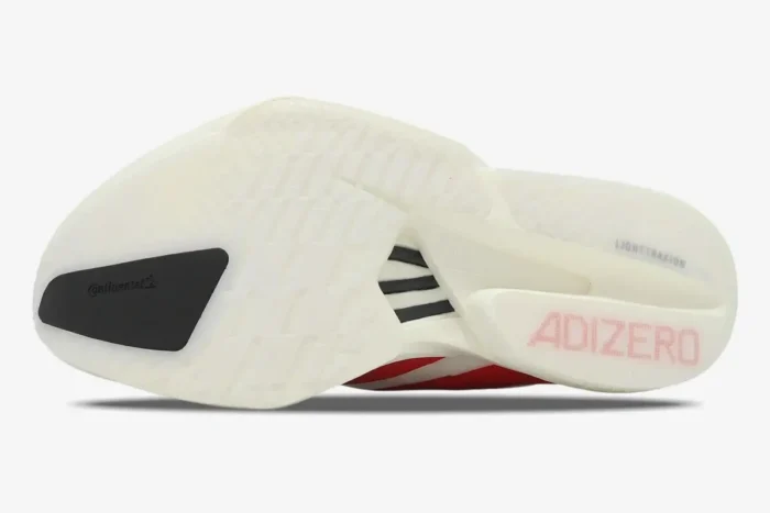 Bottom view of the Adidas Adizero Adios Pro 4 white outsole with black Continental rubber and red Adizero logo. - SKU JR6363