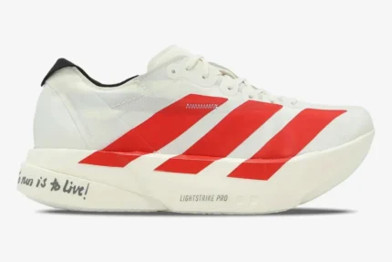 Side view of white Adidas Adizero Adios Pro 4 running shoe with red stripes and 'To run is to live!' text. - SKU JR6363