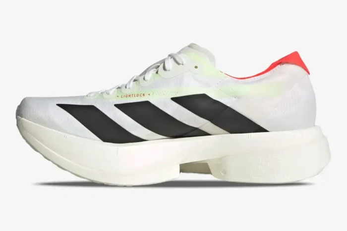 Side view of Adidas Adizero Adios Pro 4 running shoes in white, black, and red with a thick foam midsole. - SKU JR1094