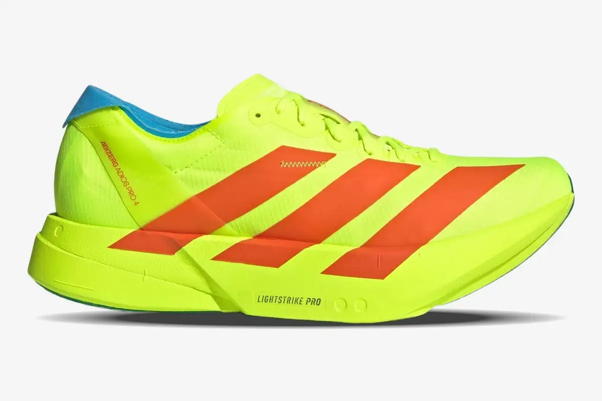 adidas-adizero-adios-pro-4-yellow-orange-side-jq1571 Adidas Adizero Adios Pro 4 running shoe in neon yellow and orange, side profile view. - SKU JQ1571