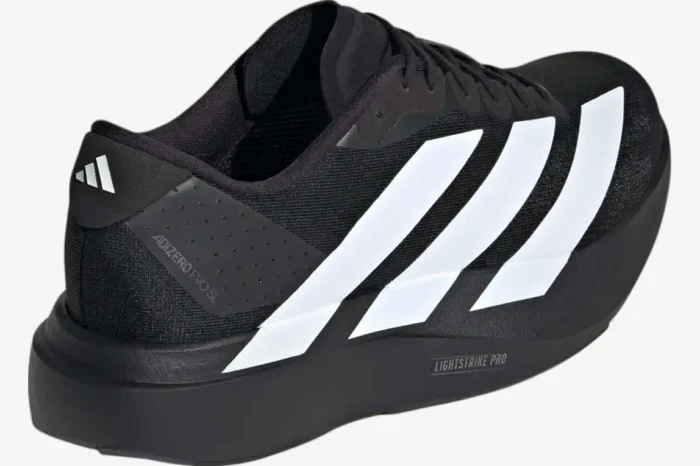 Rear view of Adidas Adizero Evo SL running shoes in Core Black and Cloud White with Lightstrike Pro foam. - SKU JP7149