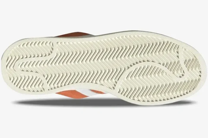 Bottom view of Adidas Campus 00s Amber Tint Orange White sneakers showing the cream herringbone outsole. - SKU ID1436