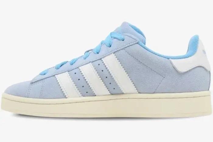 Side view of an Adidas Campus 00s sneaker in ambient sky blue suede with white stripes and a cream sole. - SKU GY9473