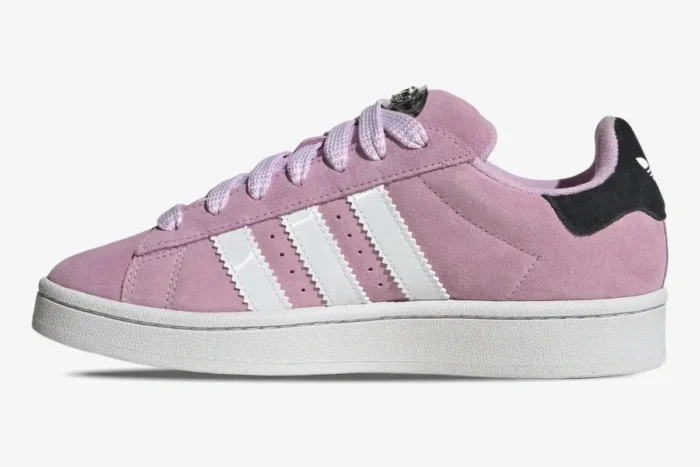 Side profile of Adidas Campus 00s Bliss Lilac sneakers featuring pink suede and white stripes. - SKU HP6395