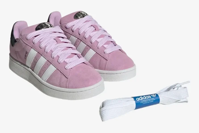 Adidas Campus 00s Bliss Lilac sneakers shown from a three-quarter angle with extra white laces. - SKU HP6395