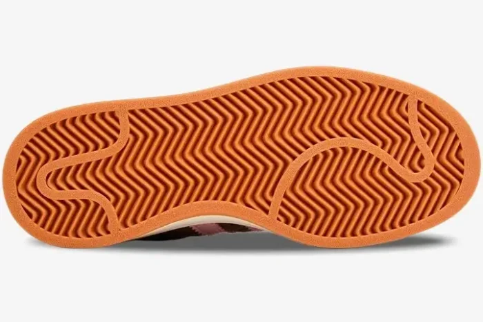 Bottom view of the orange gum rubber outsole of an Adidas Campus 00s Dust Cargo Clear Pink sneaker. - SKU HQ4569