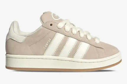 Side profile of Adidas Campus 00s sneakers in Wonder White and Wonder Beige suede with thick white laces. - SKU JQ5803