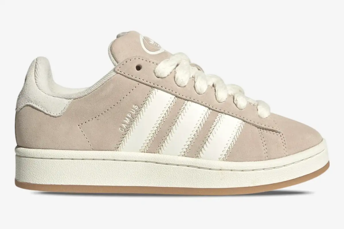 adidas-campus-00s-wonder-beige-side-view-jq5803-343-664 Side profile of Adidas Campus 00s sneakers in Wonder White and Wonder Beige suede with thick white laces. - SKU JQ5803