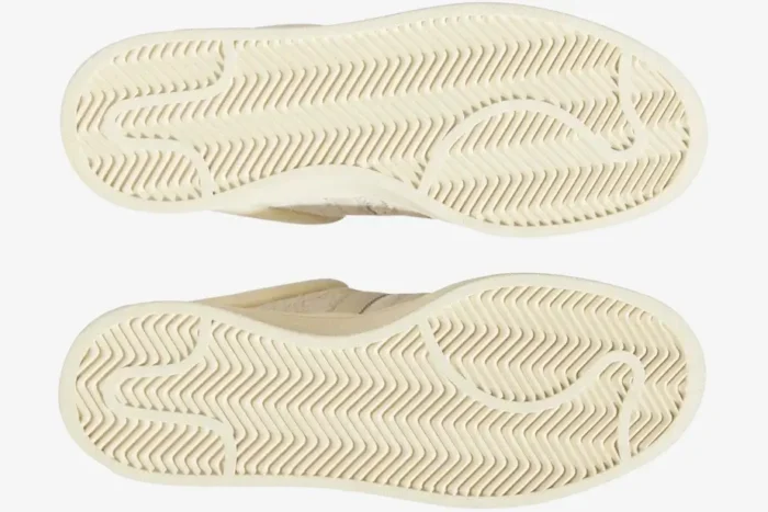 Bottom view of the cream Adidas Campus Light x Bad Bunny sneakers showing the textured rubber outsoles. - SKU FZ5823