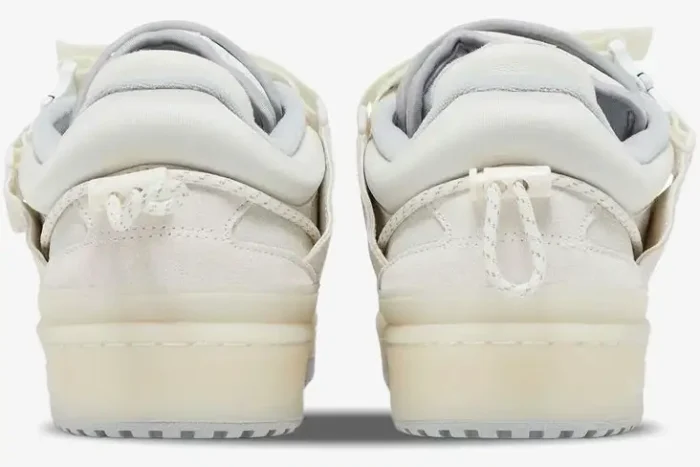 Rear view of Adidas Forum Buckle Low x Bad Bunny sneakers in white cream with toggle heel tabs. - SKU HQ2153