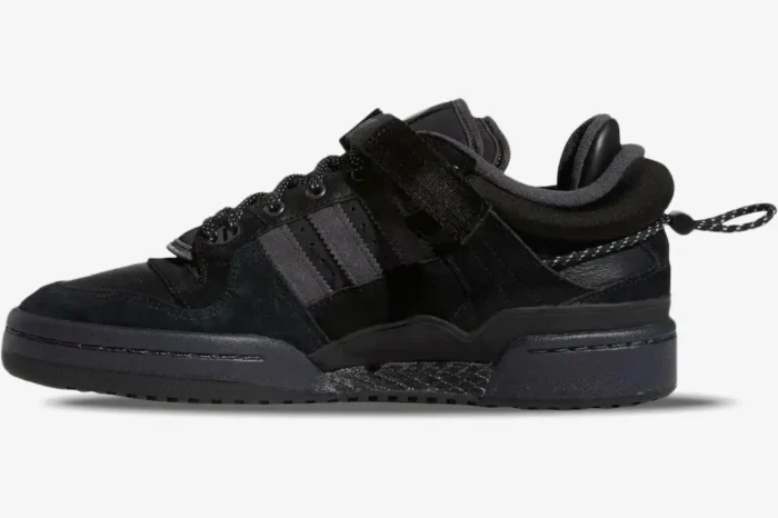 Side profile of the all-black Adidas Forum Buckle Low x Bad Bunny Back To School sneakers. - SKU GW5021