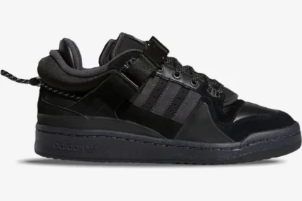 Side profile of Adidas Forum Buckle Low x Bad Bunny Back To School sneakers in triple black. - SKU GW5021