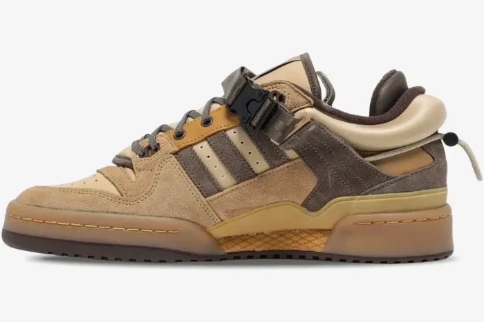 Side profile of the Adidas Forum Buckle Low x Bad Bunny Café sneaker in shades of brown and tan suede. - SKU GW0264