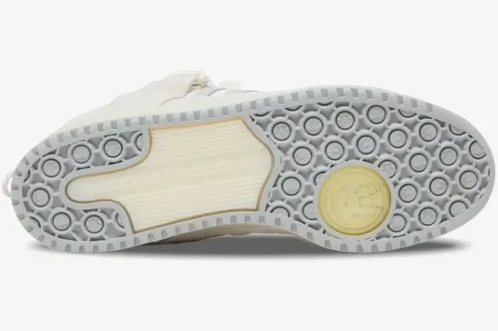 Bottom view of Adidas Forum Buckle Low x Bad Bunny White Cream outsole with circular grip pattern. - SKU HQ2153