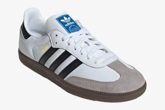 Adidas Samba OG sneakers in white leather with black stripes and gum brown soles, three-quarter view. - SKU JK3367