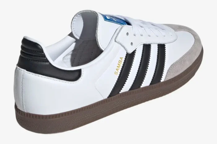 Adidas Samba OG in white and gum brown, rear-side view showing black stripes and gold lettering. - SKU JK3367