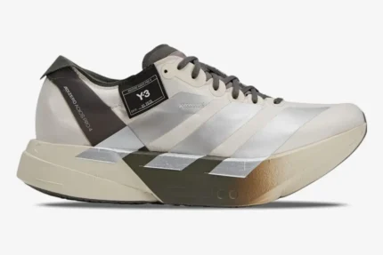 Side profile of Adidas Adizero Adios Pro 4 x Y-3 Alumina Cinder running shoe with silver stripes. - SKU JS3154