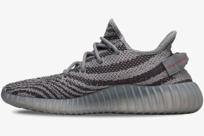 Side profile of Adidas Yeezy 350 V2 Beluga 2.0 sneakers in grey and dark grey with zebra pattern. - SKU AH2203