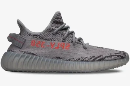 Side profile of Adidas Yeezy 350 V2 Beluga 2.0 sneakers in grey with orange SPLY-350 text. - SKU AH2203