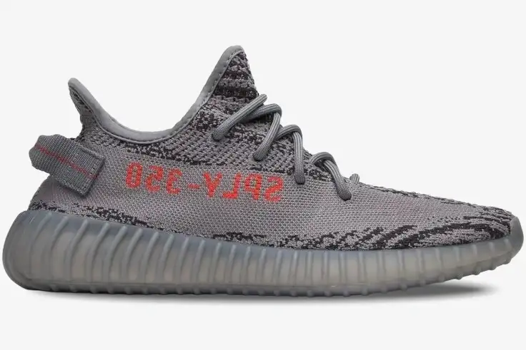 adidas-yeezy-350-v2-beluga-2-side-view-ah2203-721-566 Side profile of Adidas Yeezy 350 V2 Beluga 2.0 sneakers in grey with orange SPLY-350 text. - SKU AH2203