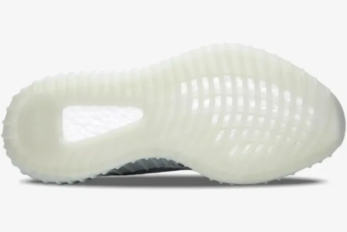 Bottom view of Adidas Yeezy 350 V2 Blue Tint showing the translucent white outsole and Boost cushioning. - SKU B37571