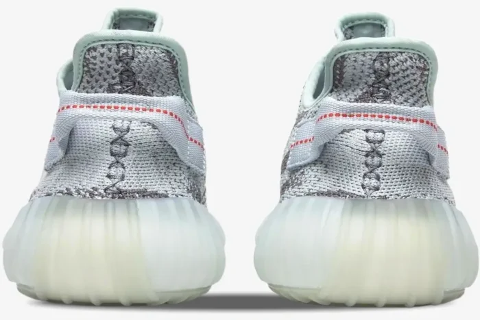 Rear view of Adidas Yeezy 350 V2 Blue Tint sneakers showing the heel tab and translucent sole. - SKU B37571