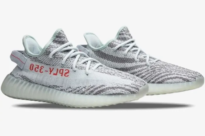 Adidas Yeezy Boost 350 V2 Blue Tint sneakers in a side-profile view with red SPLY-350 text. - SKU B37571
