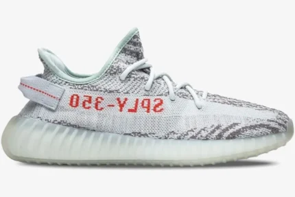 Side profile of Adidas Yeezy Boost 350 V2 Blue Tint sneakers with grey and icy blue Primeknit upper. - SKU B37571
