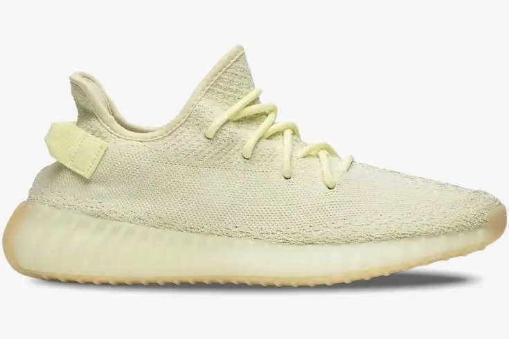 adidas-yeezy-350-v2-butter-side-view-f36980-474-375 Side profile view of the Adidas Yeezy 350 V2 Butter sneaker in a pale yellow knit. - SKU F36980