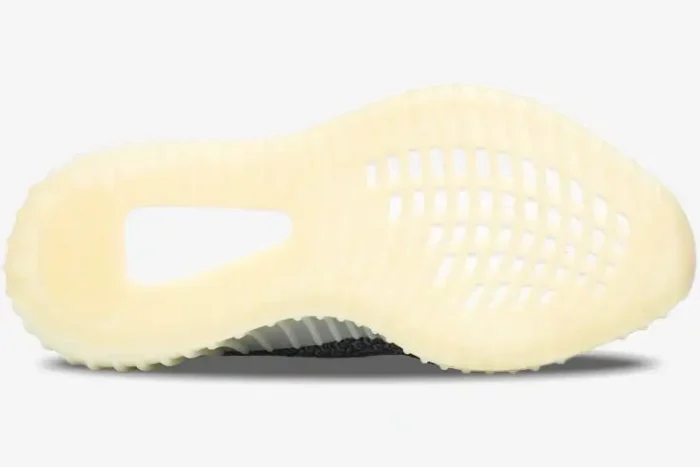 Bottom view of Adidas Yeezy 350 V2 Carbon sneakers showing the cream-colored translucent outsole. - SKU FZ5000