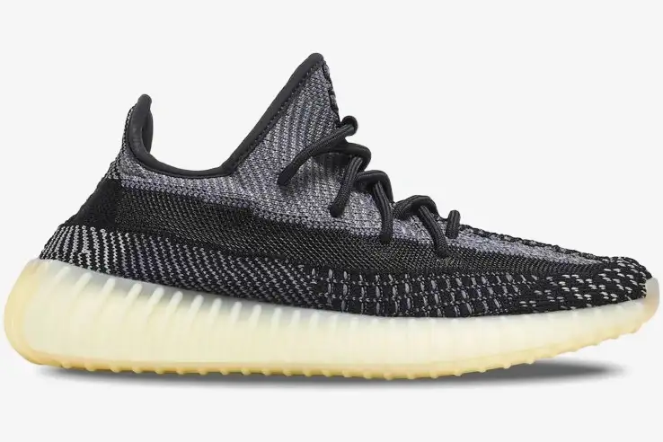 adidas-yeezy-350-v2-carbon-side-view-fz5000-413-588 Side profile of Adidas Yeezy 350 V2 Carbon sneakers featuring black and grey knit with a cream sole. - SKU FZ5000