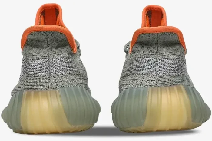 Rear view of Adidas Yeezy 350 V2 Desert Sage sneakers featuring grey knit uppers and bright orange collars. - SKU FX9035