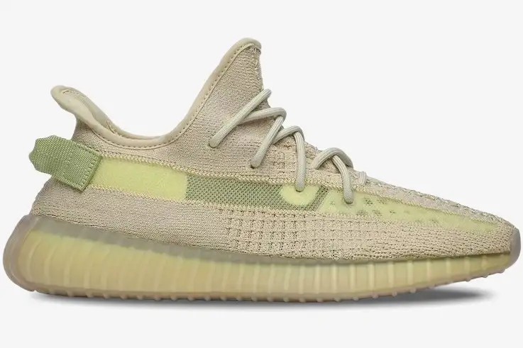 adidas-yeezy-350-v2-flax-side-view-fx9028-590-211 Side profile view of the Adidas Yeezy 350 V2 Flax sneaker in pale yellow and beige. - SKU FX9028