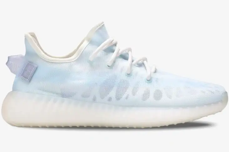 adidas-yeezy-350-v2-mono-ice-side-view-gw2869-078-889 Side profile of Adidas Yeezy 350 V2 Mono Ice sneakers in light blue with a translucent white sole. - SKU GW2869
