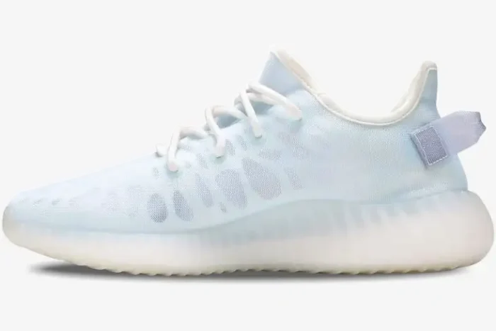 Side profile of Adidas Yeezy 350 V2 Mono Ice sneakers in pale blue with a translucent white sole. - SKU GW2869