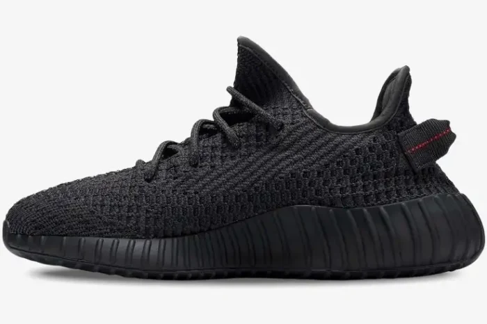 Side profile of an Adidas Yeezy 350 V2 Static Black Non-Reflective sneaker with a black Primeknit upper. - SKU FU9006