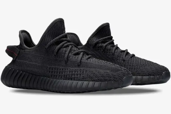 Side view of Adidas Yeezy 350 V2 Static Black Non-Reflective sneakers with black primeknit and ribbed soles. - SKU FU9006