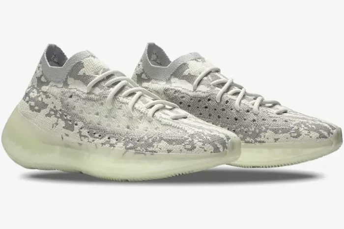 Side view of Adidas Yeezy 380 Alien sneakers featuring a grey camo Primeknit upper and translucent green soles. - SKU FV3260