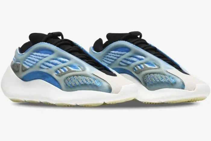Side view of Adidas Yeezy 700 V3 Arzareth sneakers with blue knit upper and white soles. - SKU G54850