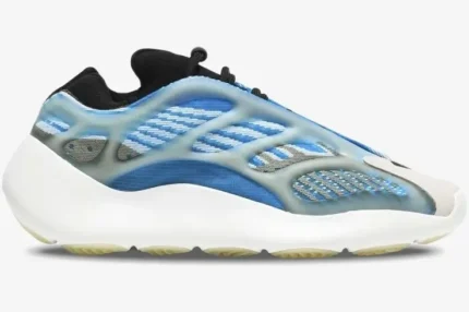 Side profile of Adidas Yeezy 700 V3 Arzareth sneakers in blue and white with a translucent cage. - SKU G54850