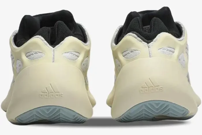 Rear view of Adidas Yeezy 700 V3 Azael sneakers in cream and white with black lining. - SKU FW4980