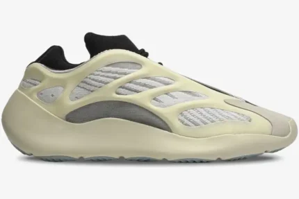 Side view of Adidas Yeezy 700 V3 Azael sneakers in cream and grey with a black collar. - SKU FW4980
