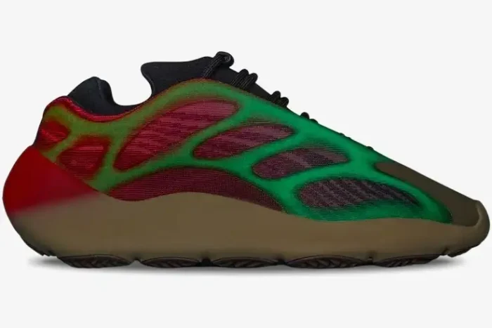 Side profile of Adidas Yeezy 700 V3 Fade Carbon sneakers with a green to red gradient cage and tan midsole. - SKU GW1814